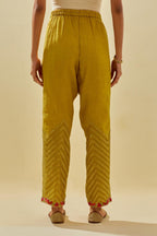 Yellow tissue chanderi straight pants with hand cut silk flower embroidery at hem, highlighted with gold sequins and beads.