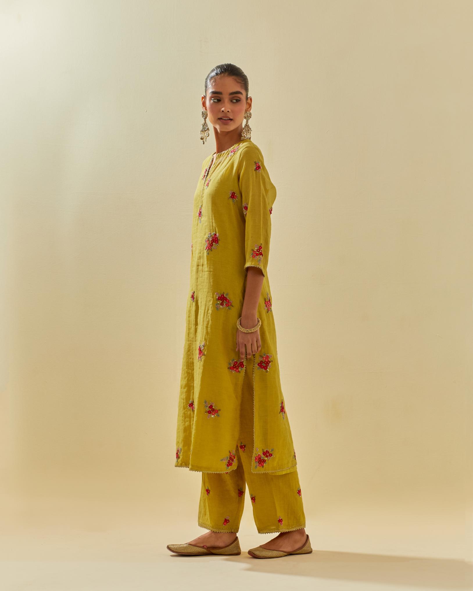 Yellow tissue chanderi straight kurta set with randomly placed hand cut silk flower bunches, highlighted with gold sequins.