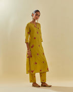 Yellow tissue chanderi straight kurta set with randomly placed hand cut silk flower bunches, highlighted with gold sequins.