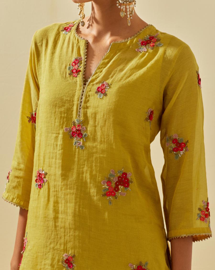 Yellow tissue chanderi straight kurta set with randomly placed hand cut silk flower bunches, highlighted with gold sequins.
