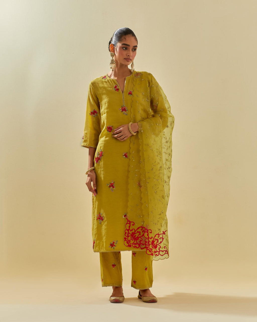 Yellow tissue chanderi straight kurta set with randomly placed hand cut silk flower bunches, highlighted with gold sequins.