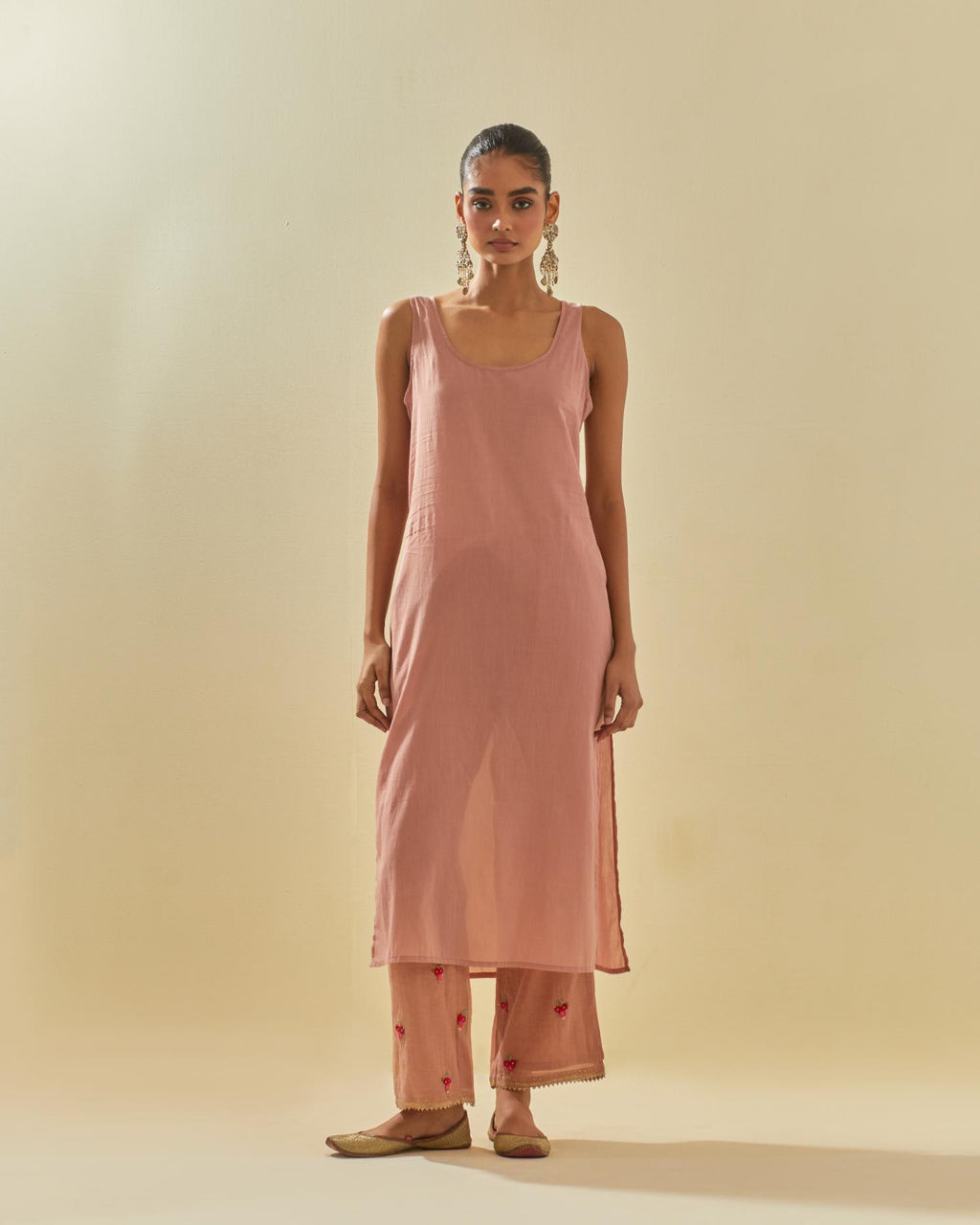 Pink tissue chanderi straight kurta set with randomly placed hand cut silk flower bunches, highlighted with gold sequins.