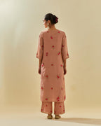 Pink tissue chanderi straight kurta set with randomly placed hand cut silk flower bunches, highlighted with gold sequins.