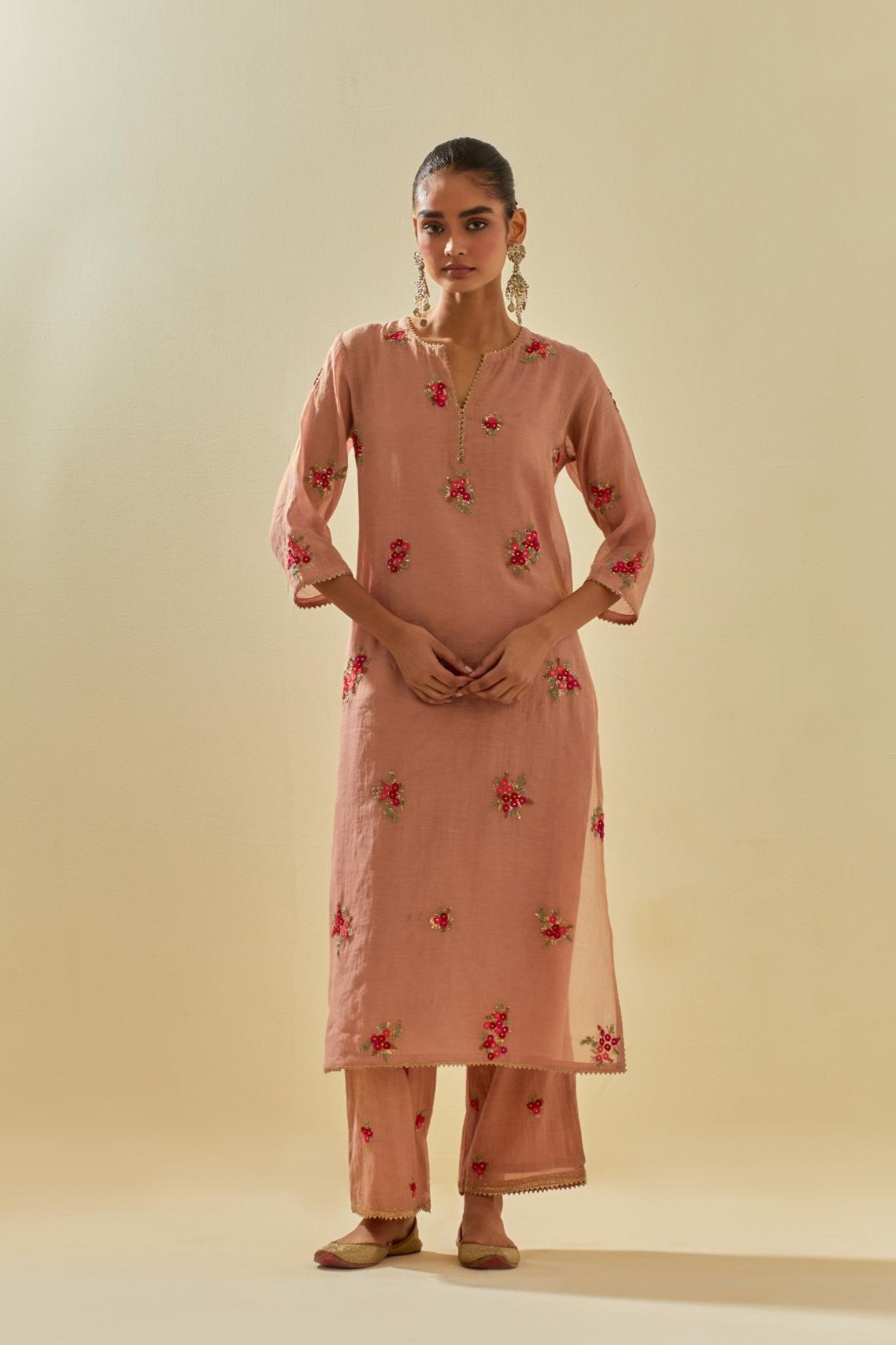 Pink tissue chanderi straight kurta set with randomly placed hand cut silk flower bunches, highlighted with gold sequins.