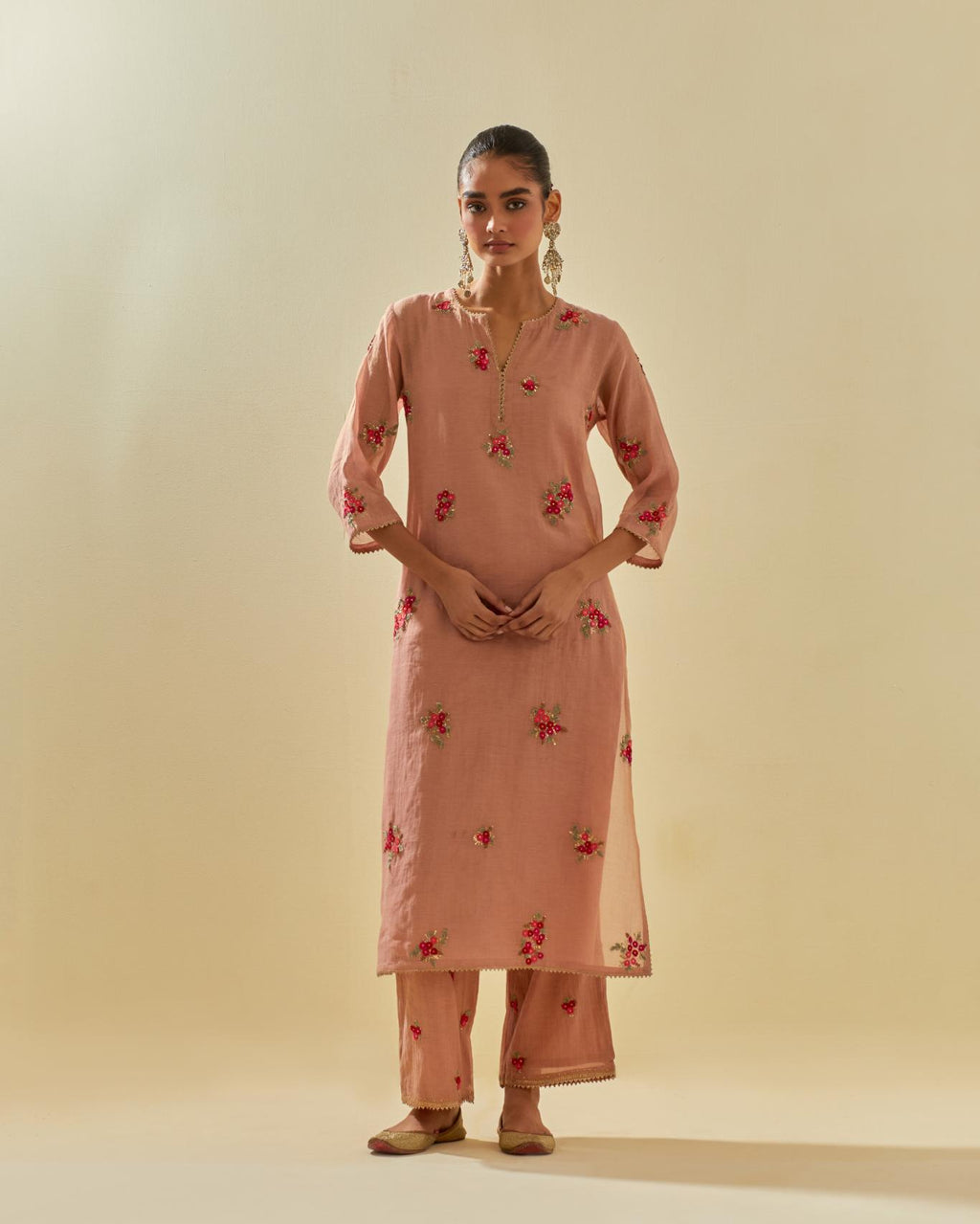 Pink tissue chanderi straight kurta set with randomly placed hand cut silk flower bunches, highlighted with gold sequins.