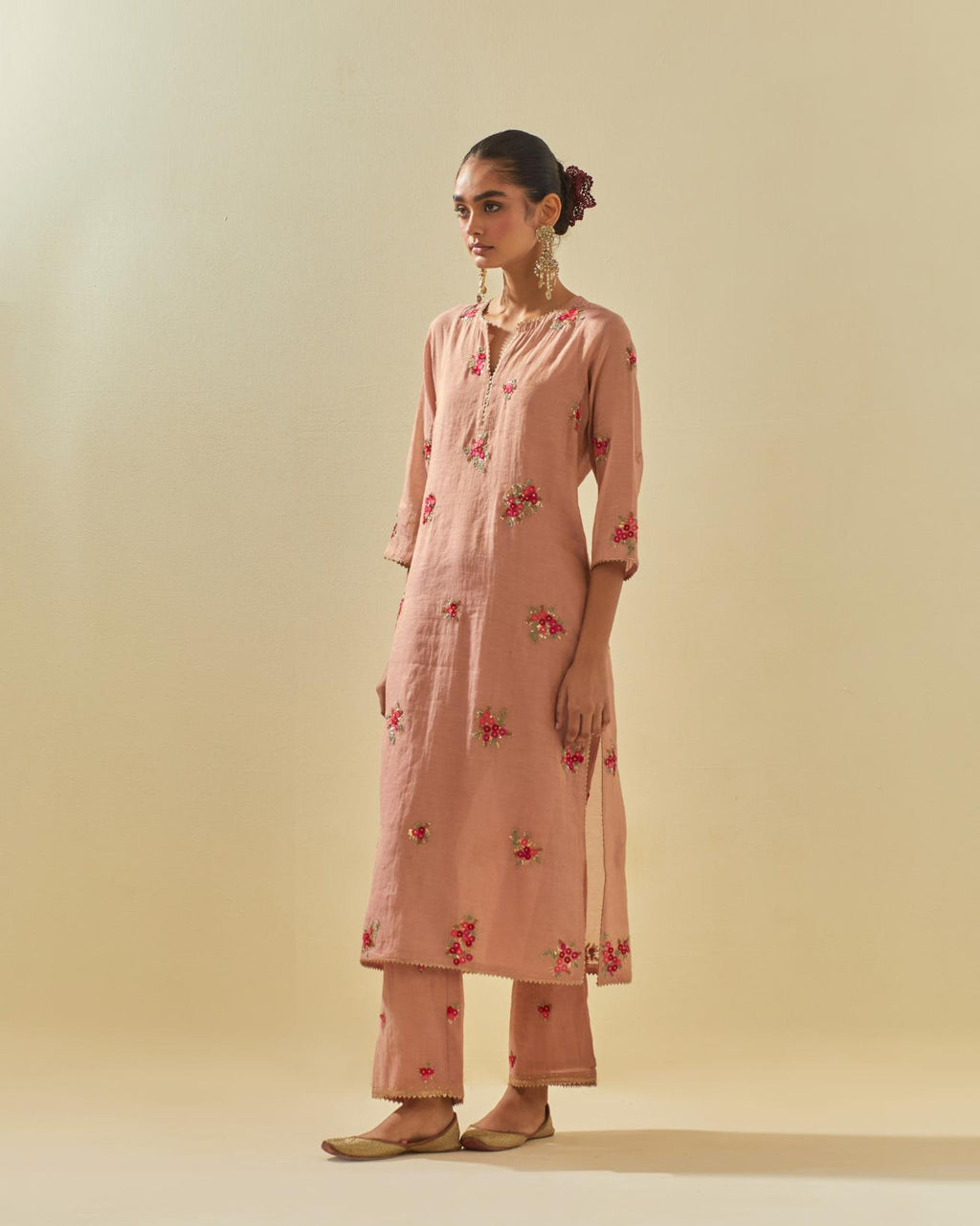 Pink tissue chanderi straight kurta set with randomly placed hand cut silk flower bunches, highlighted with gold sequins.