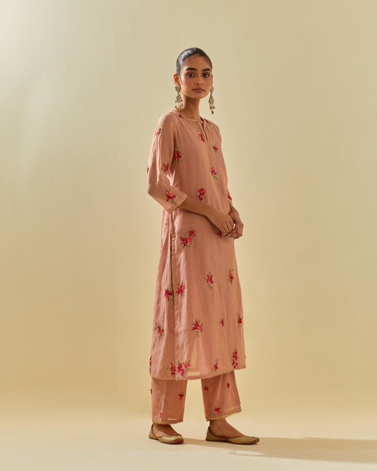 Pink tissue chanderi straight kurta set with randomly placed hand cut silk flower bunches, highlighted with gold sequins.