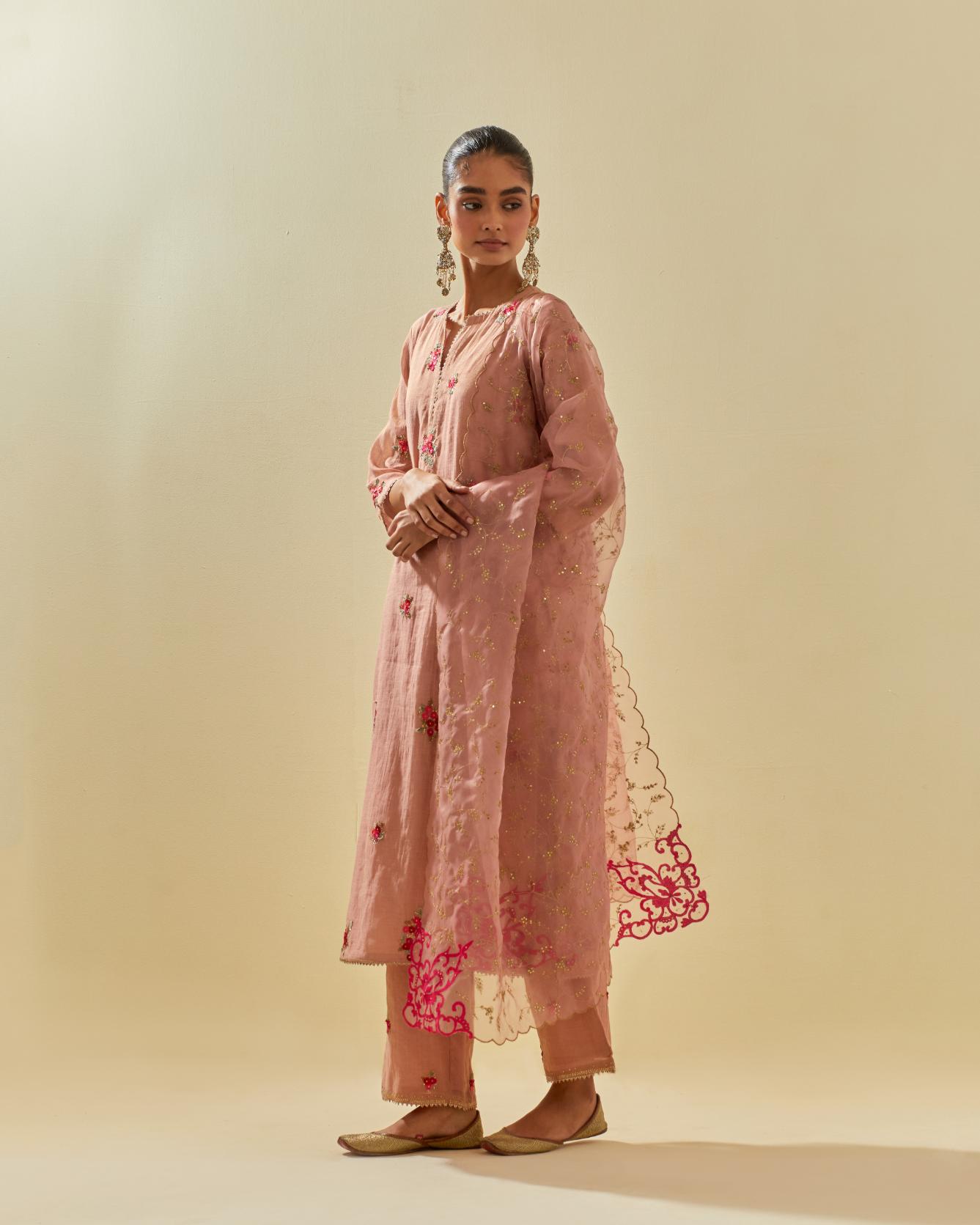 Pink tissue chanderi straight kurta set with randomly placed hand cut silk flower bunches, highlighted with gold sequins.