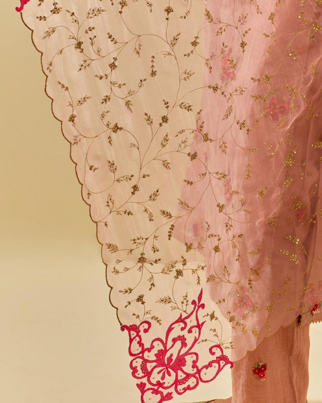 Pink silk organza dupatta with all-over delicate gold zari embroidery & silk applique work, highlighted with gold sequins.