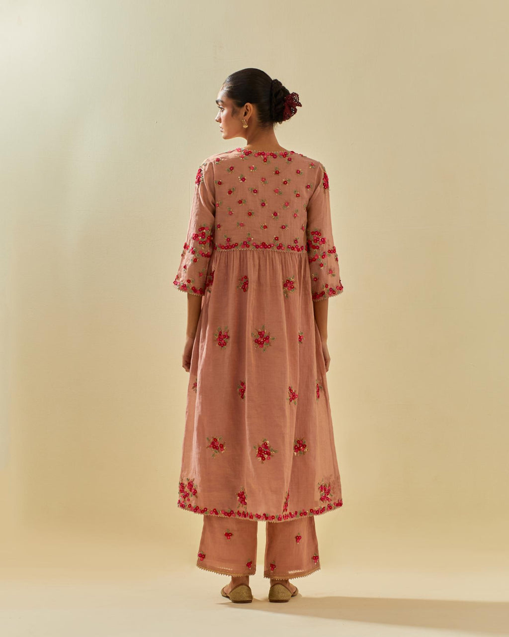 Pink tissue chanderi hand cut silk flower embroidered kurta dress set with fine gathers at empire line.