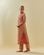 Pink tissue chanderi straight kurta set with delicate hand cut silk flower embroidery, highlighted with gold sequins and beads.