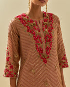 Pink tissue chanderi straight kurta set with delicate hand cut silk flower embroidery, highlighted with gold sequins and beads.