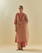 Pink tissue chanderi straight kurta set with delicate hand cut silk flower embroidery, highlighted with gold sequins and beads.