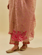 Pink tissue chanderi straight kurta set with delicate hand cut silk flower embroidery, highlighted with gold sequins and beads.