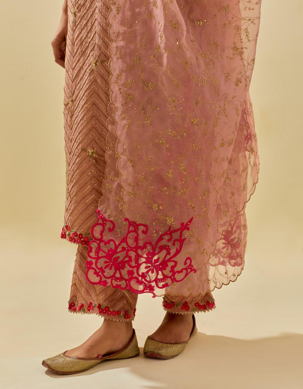 Pink tissue chanderi straight kurta set with delicate hand cut silk flower embroidery, highlighted with gold sequins and beads.