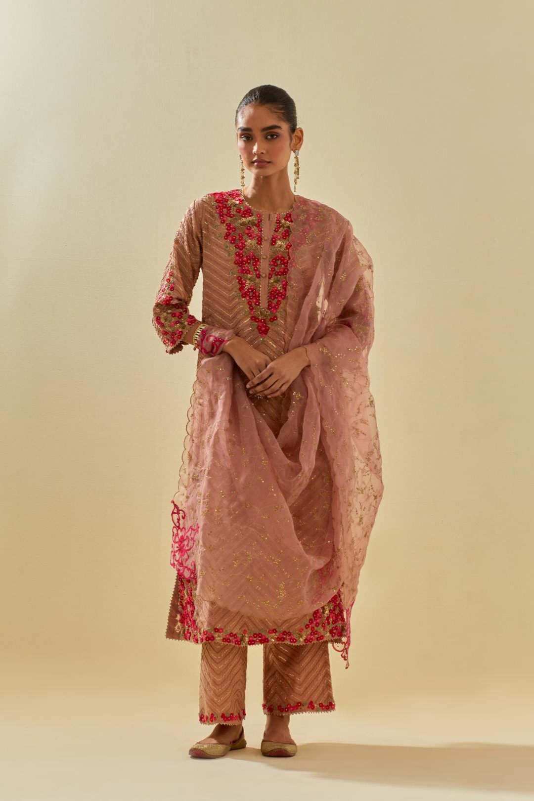 Pink tissue chanderi straight kurta set with delicate hand cut silk flower embroidery, highlighted with gold sequins and beads.