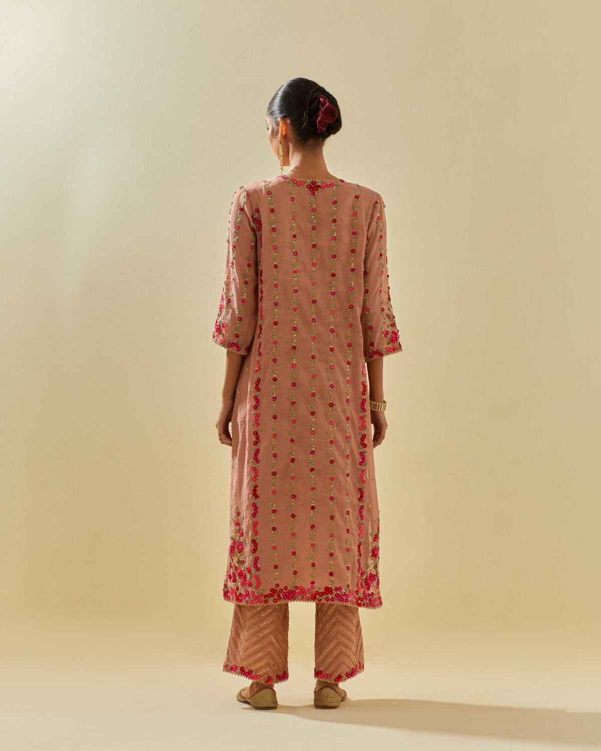 Pink tissue chanderi paneled kurta set with front placket neckline and all-over hand cut silk flower embroidery.