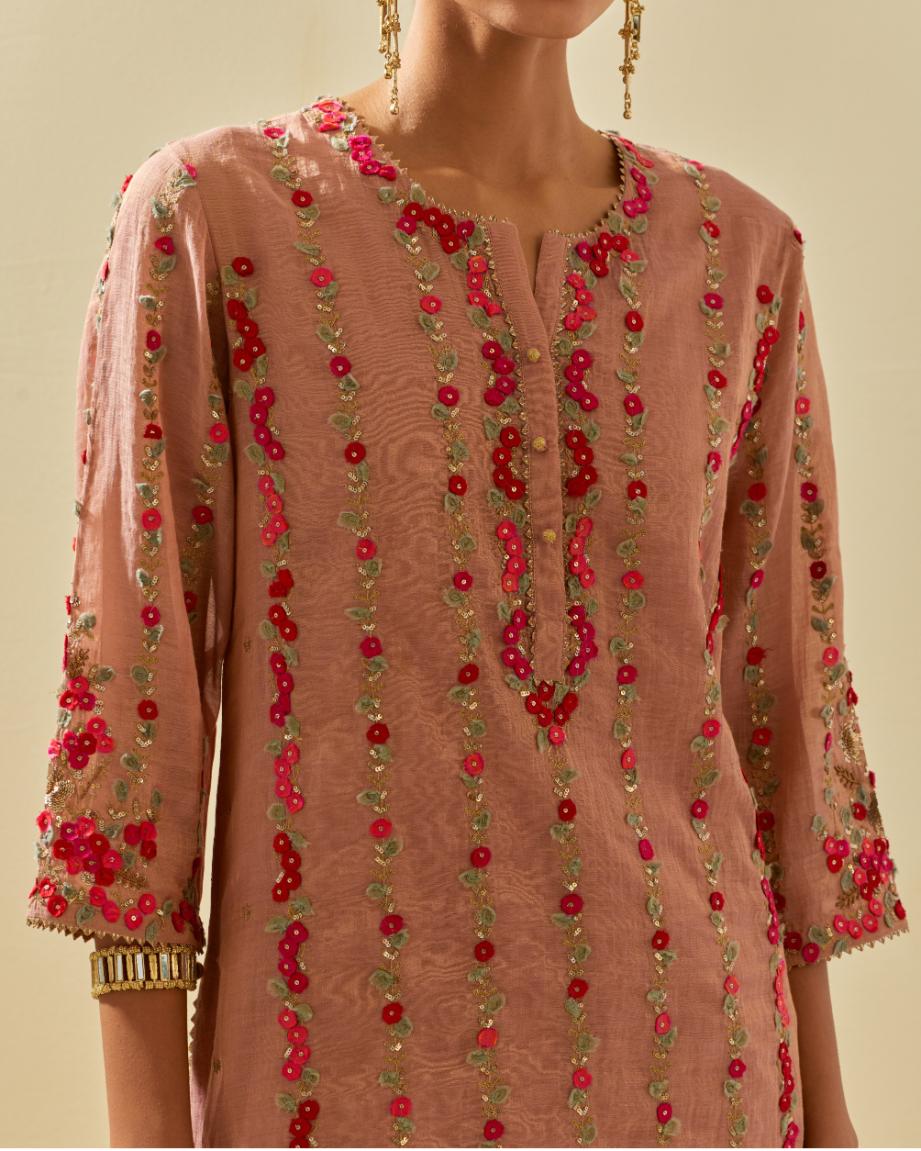 Pink tissue chanderi paneled kurta set with front placket neckline and all-over hand cut silk flower embroidery.