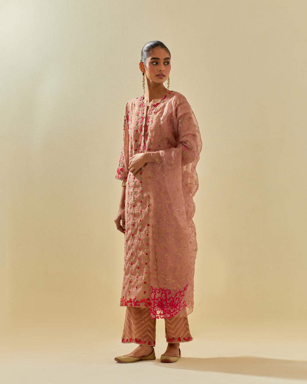 Pink silk organza dupatta with all-over delicate gold zari embroidery & silk applique work, highlighted with gold sequins.