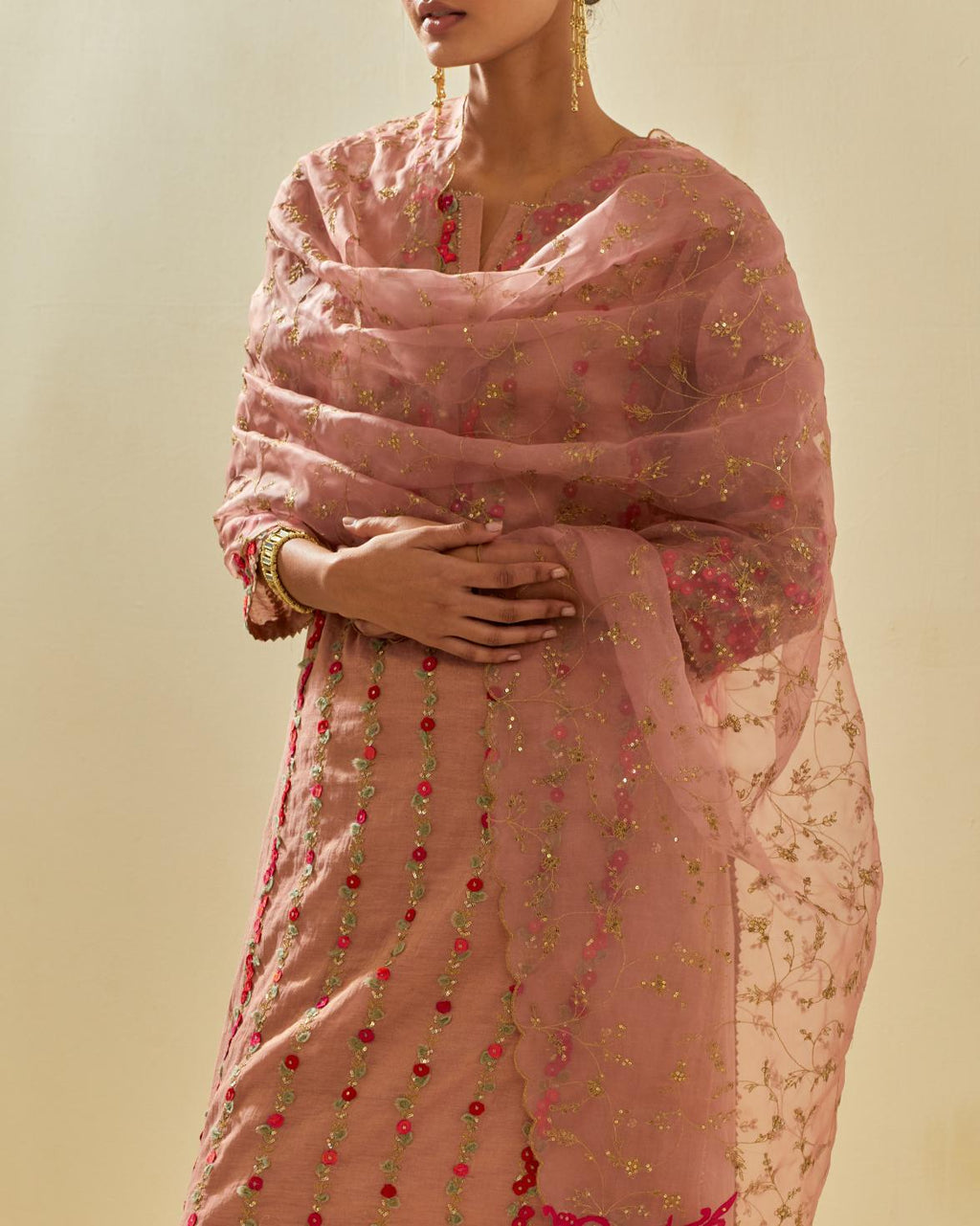 Pink silk organza dupatta with all-over delicate gold zari embroidery & silk applique work, highlighted with gold sequins.