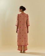 Pink tissue chanderi straight kurta set, with contrast silk hand cut flowers embroidery, highlighted with gold sequins.