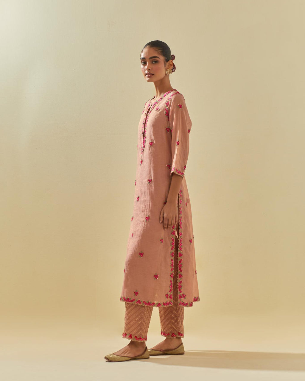 Pink tissue chanderi straight kurta set, with contrast silk hand cut flowers embroidery, highlighted with gold sequins.