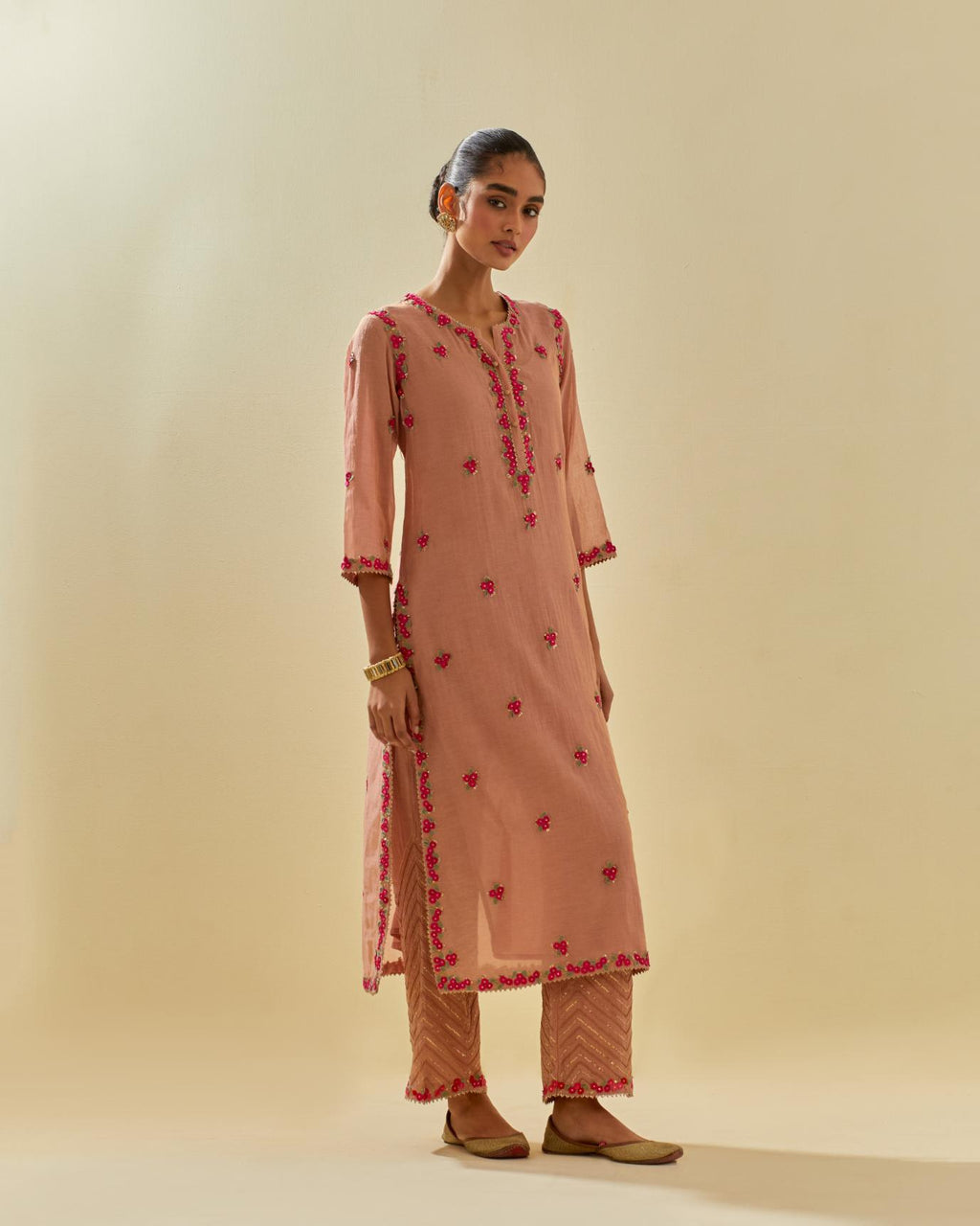 Pink tissue chanderi straight kurta set, with contrast silk hand cut flowers embroidery, highlighted with gold sequins.
