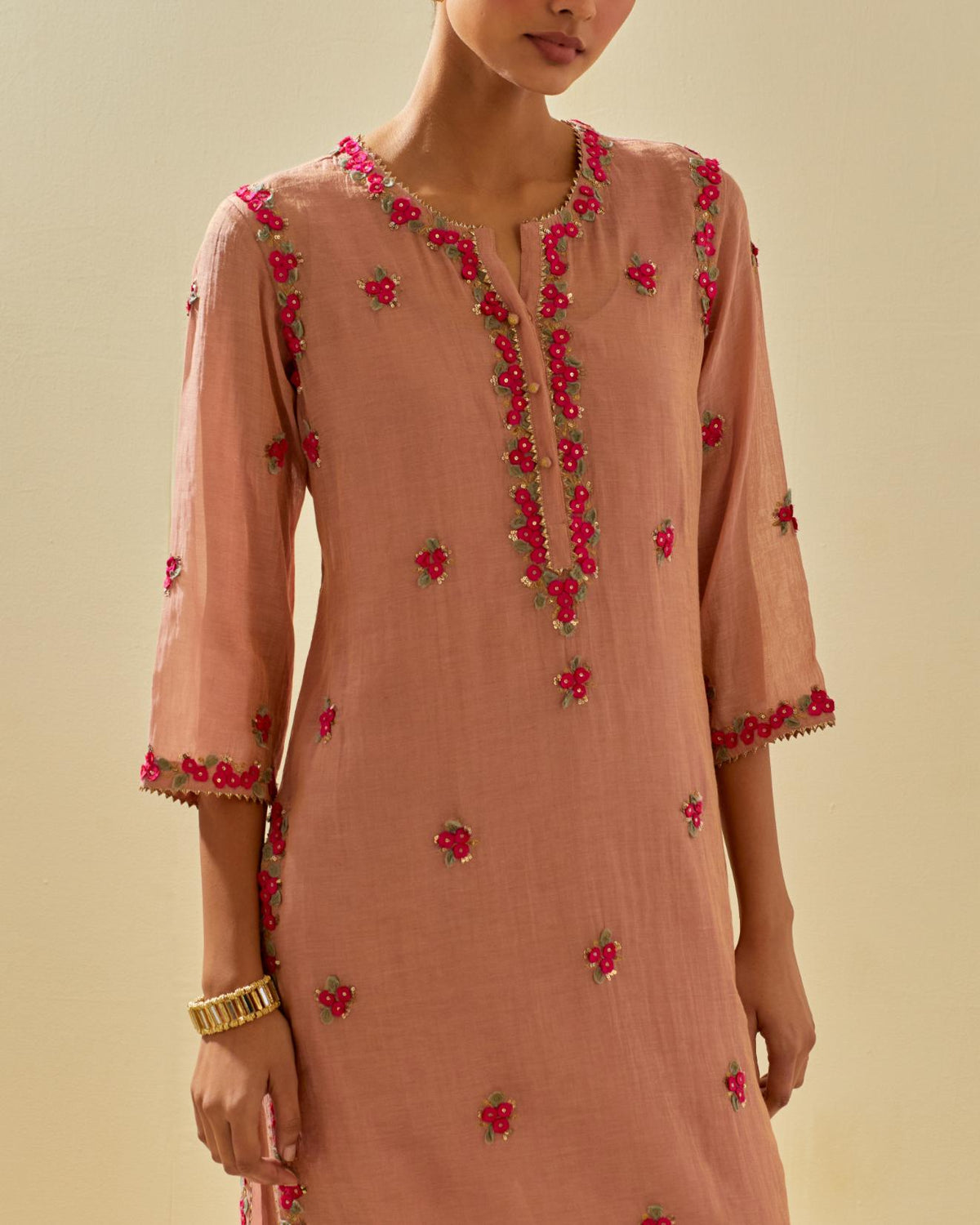 Pink tissue chanderi straight kurta set, with contrast silk hand cut flowers embroidery, highlighted with gold sequins.