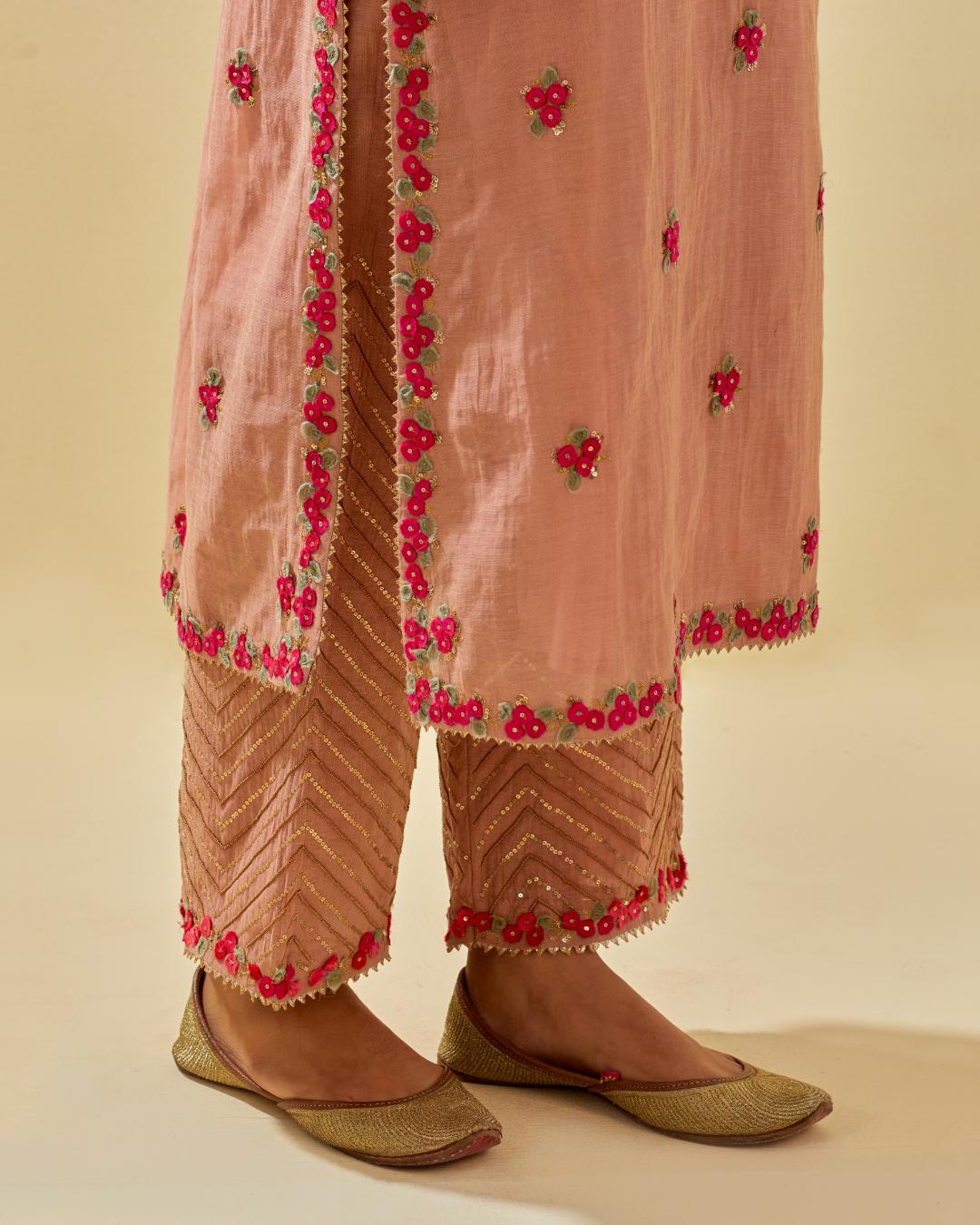 Pink tissue chanderi straight kurta set, with contrast silk hand cut flowers embroidery, highlighted with gold sequins.
