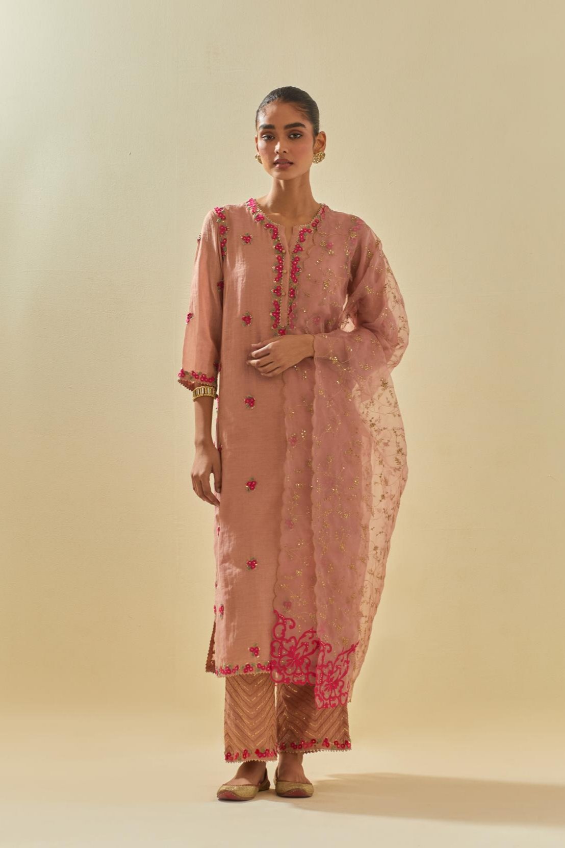 Pink tissue chanderi straight kurta set, with contrast silk hand cut flowers embroidery, highlighted with gold sequins.
