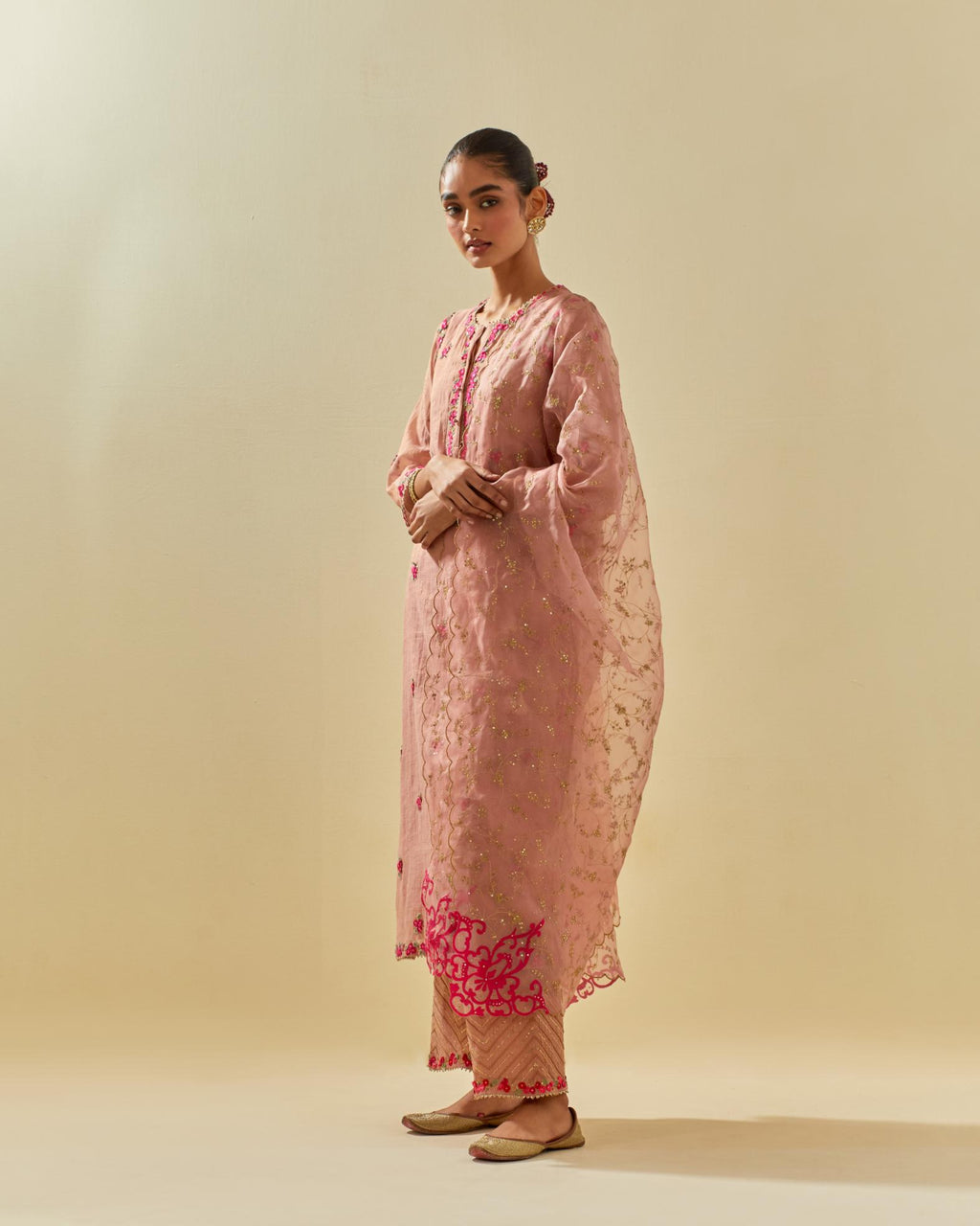 Pink tissue chanderi straight kurta set, with contrast silk hand cut flowers embroidery, highlighted with gold sequins.