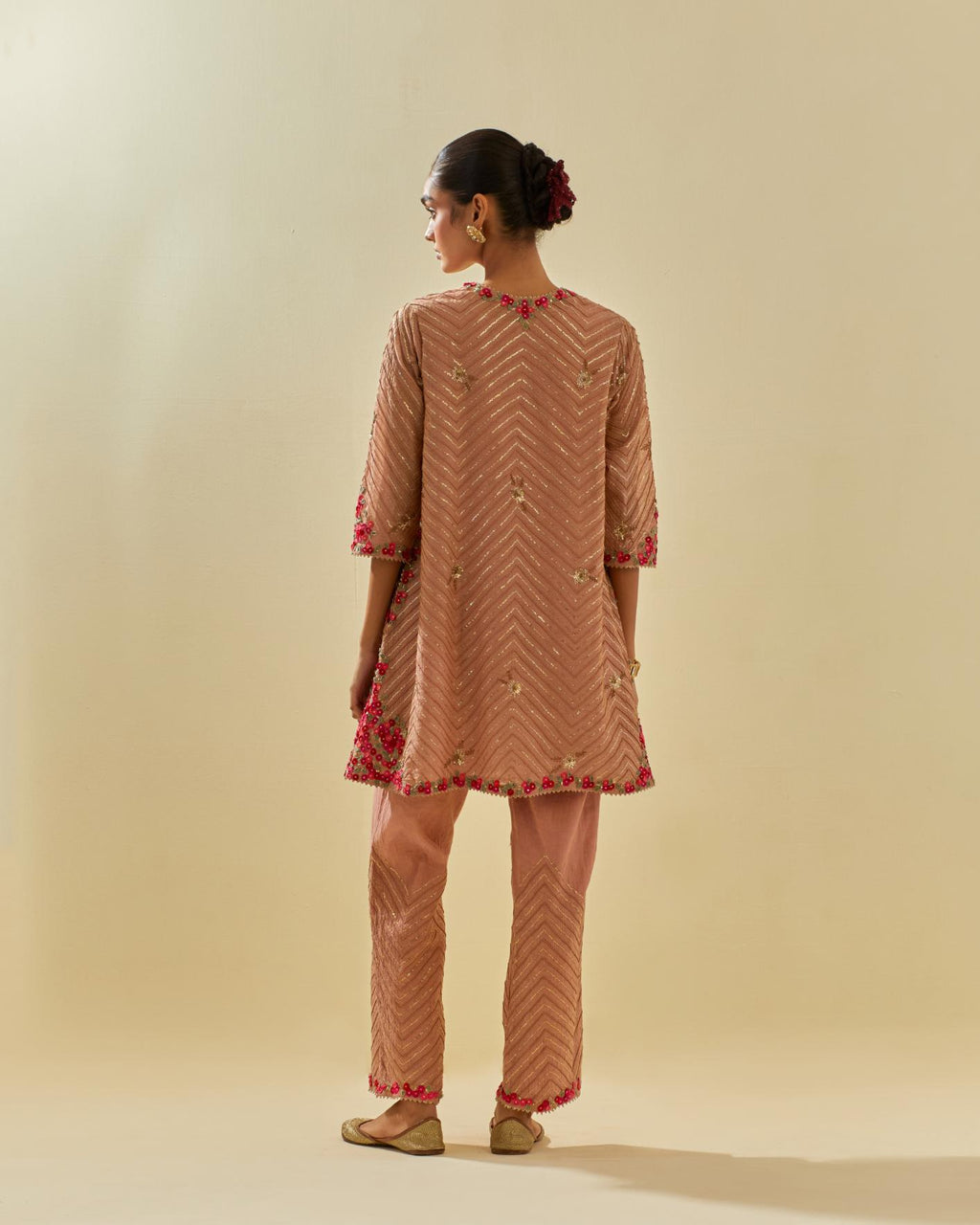 Pink tissue chanderi easy fit short kurta set, highlighted with gold sequins and beads.
