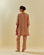 Pink tissue chanderi easy fit short kurta set, highlighted with gold sequins and beads.