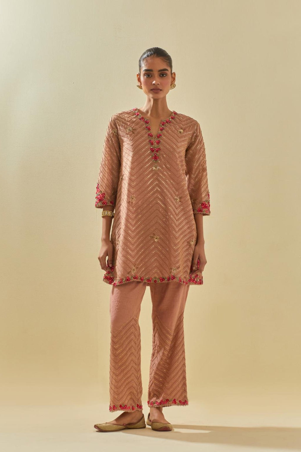 Pink tissue chanderi easy fit short kurta set, highlighted with gold sequins and beads.