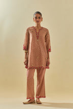 Pink tissue chanderi easy fit short kurta set, highlighted with gold sequins and beads.