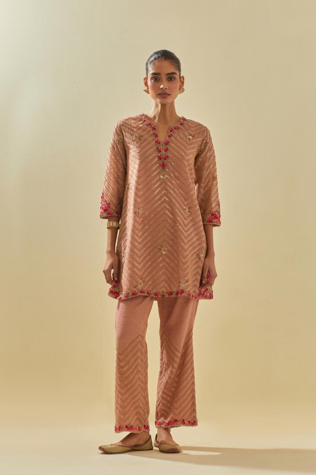 Pink tissue chanderi easy fit short kurta set, highlighted with gold sequins and beads.