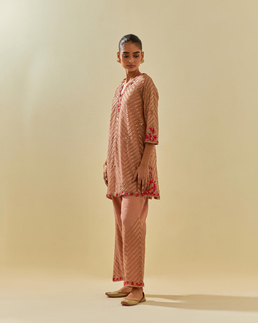Pink tissue chanderi easy fit short kurta set, highlighted with gold sequins and beads.