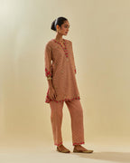 Pink tissue chanderi easy fit short kurta set, highlighted with gold sequins and beads.