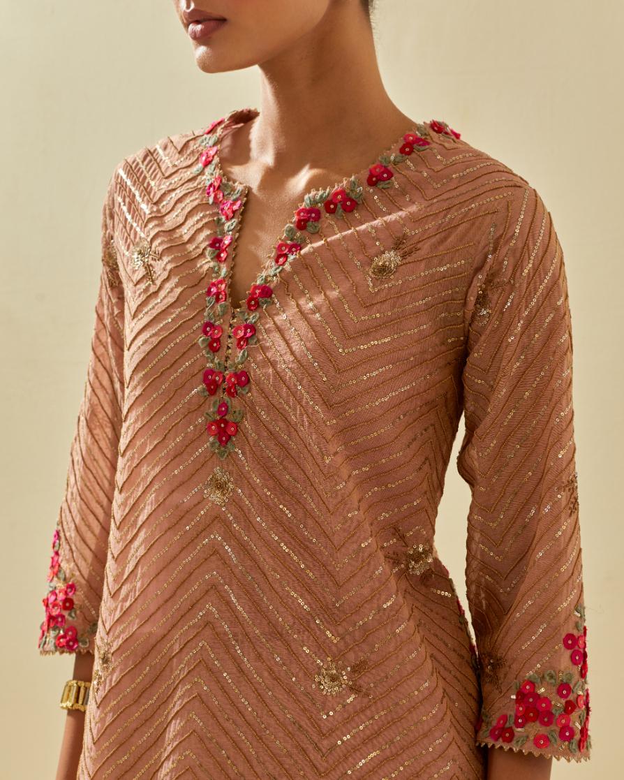 Pink tissue chanderi easy fit short kurta set, highlighted with gold sequins and beads.