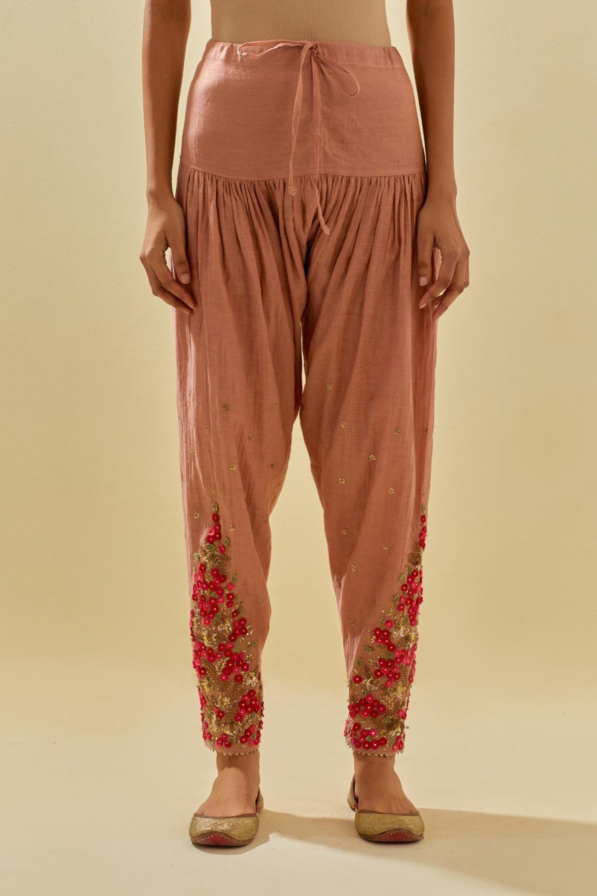 Pink tissue chanderi salwar with hand cut silk flower embroidery, highlighted with gold sequins.