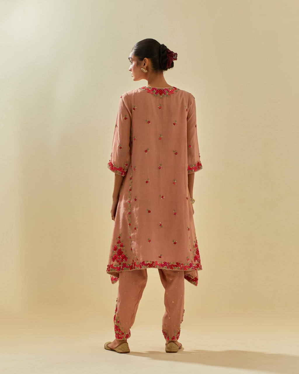 Pink tissue chanderi mid length kalidar kurta set with hand cut silk flower embroidery, highlighted with gold sequins.