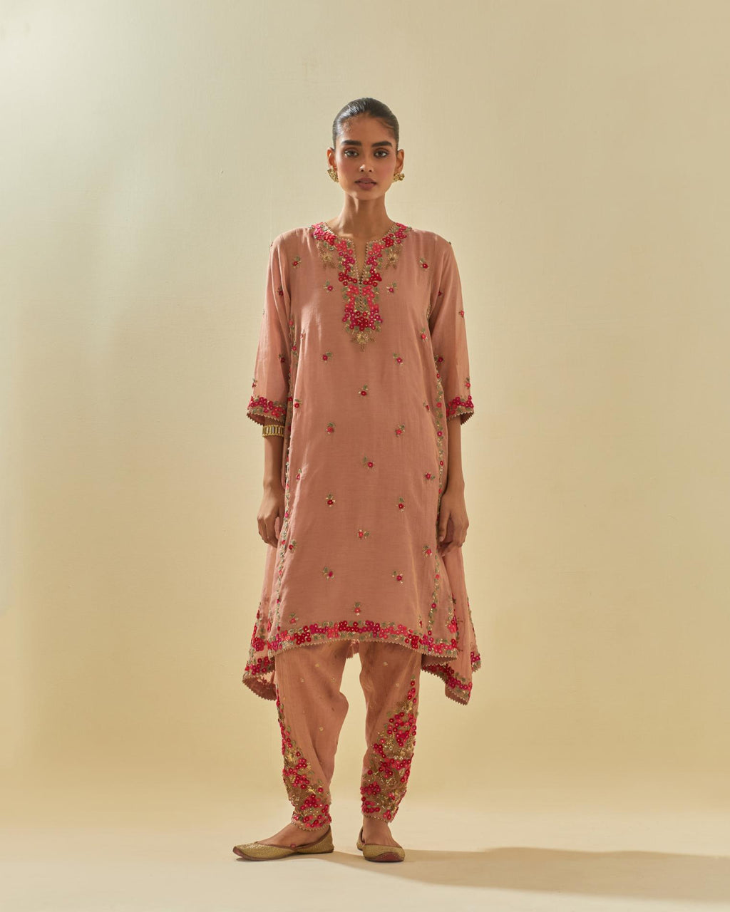 Pink tissue chanderi mid length kalidar kurta set with hand cut silk flower embroidery, highlighted with gold sequins.