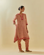 Pink tissue chanderi mid length kalidar kurta set with hand cut silk flower embroidery, highlighted with gold sequins.