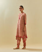 Pink tissue chanderi mid length kalidar kurta set with hand cut silk flower embroidery, highlighted with gold sequins.