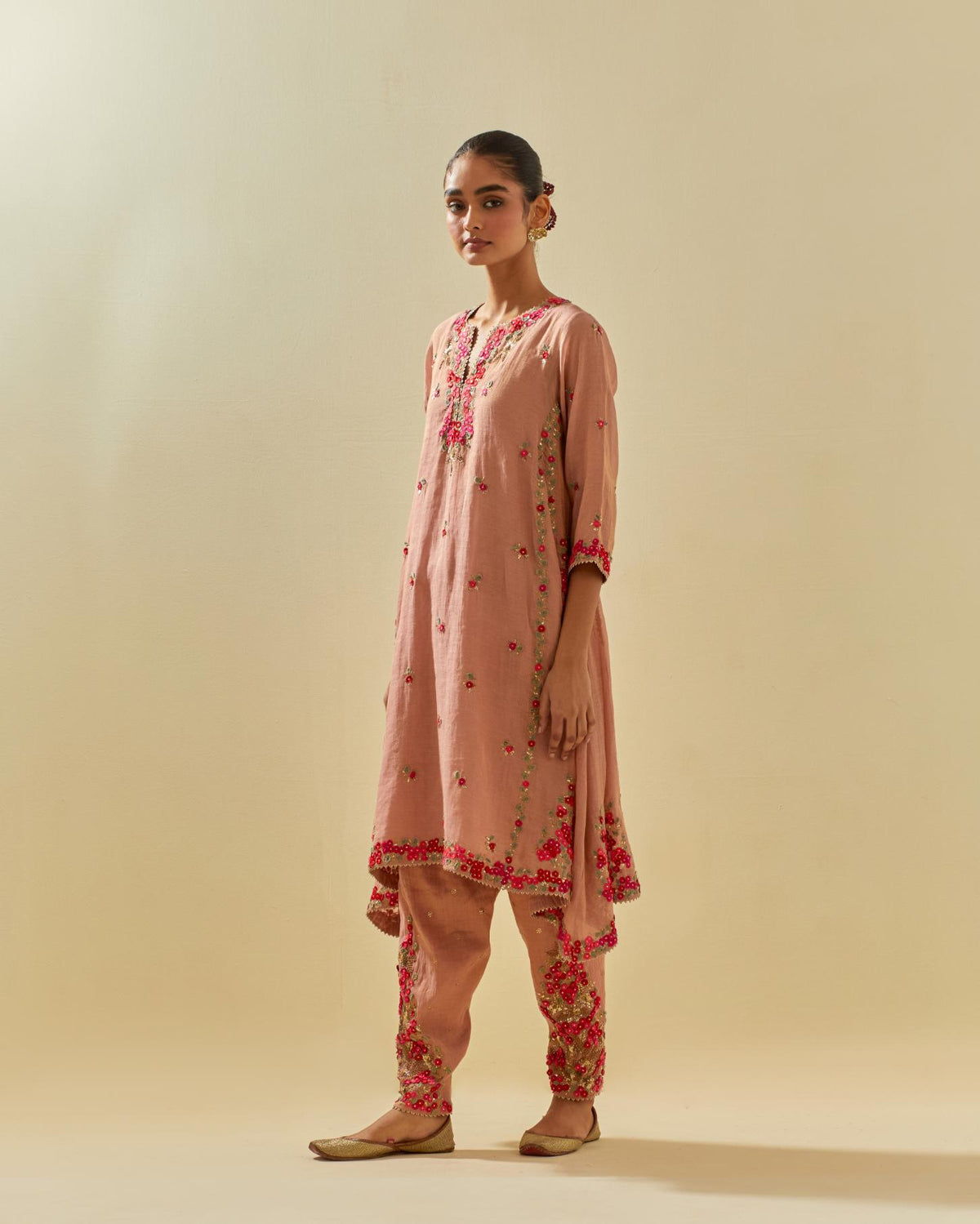 Pink tissue chanderi mid length kalidar kurta set with hand cut silk flower embroidery, highlighted with gold sequins.