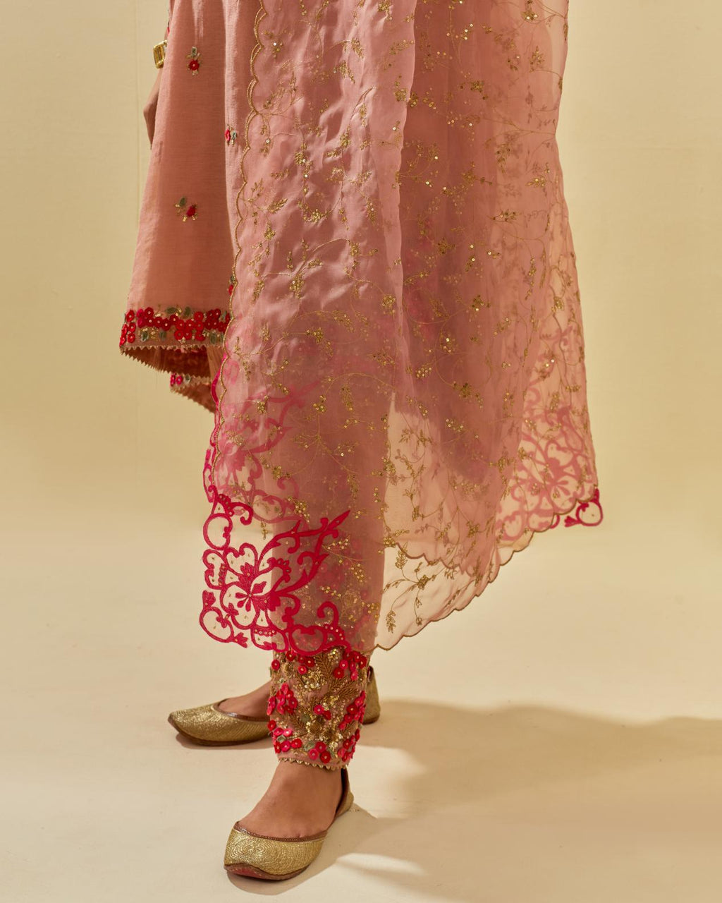 Pink tissue chanderi mid length kalidar kurta set with hand cut silk flower embroidery, highlighted with gold sequins.