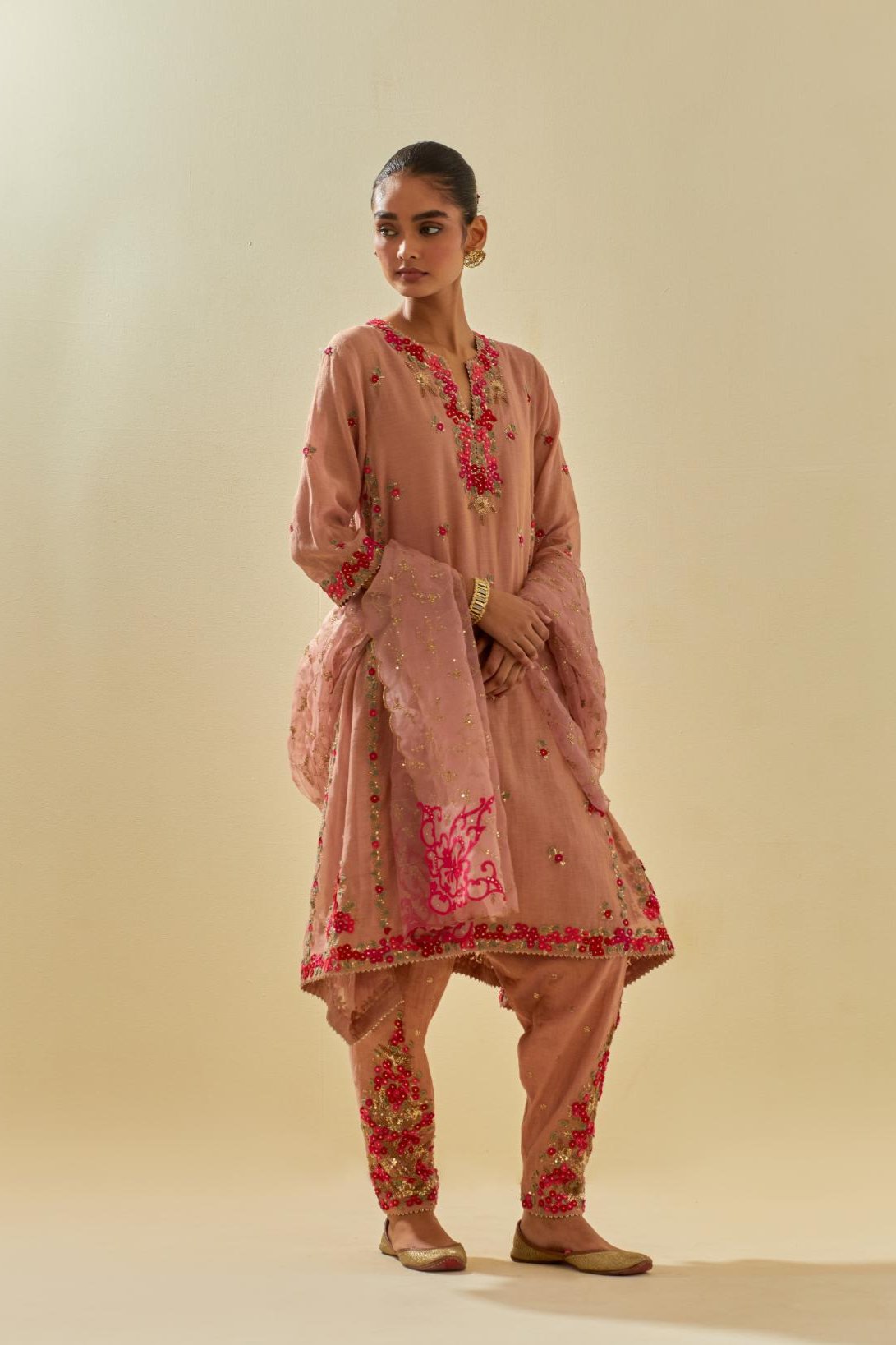 Pink tissue chanderi mid length kalidar kurta set with hand cut silk flower embroidery, highlighted with gold sequins.