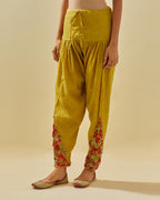 Yellow tissue chanderi salwar with hand cut silk flower embroidery, highlighted with gold sequins.