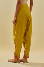 Yellow tissue chanderi salwar with hand cut silk flower embroidery, highlighted with gold sequins.