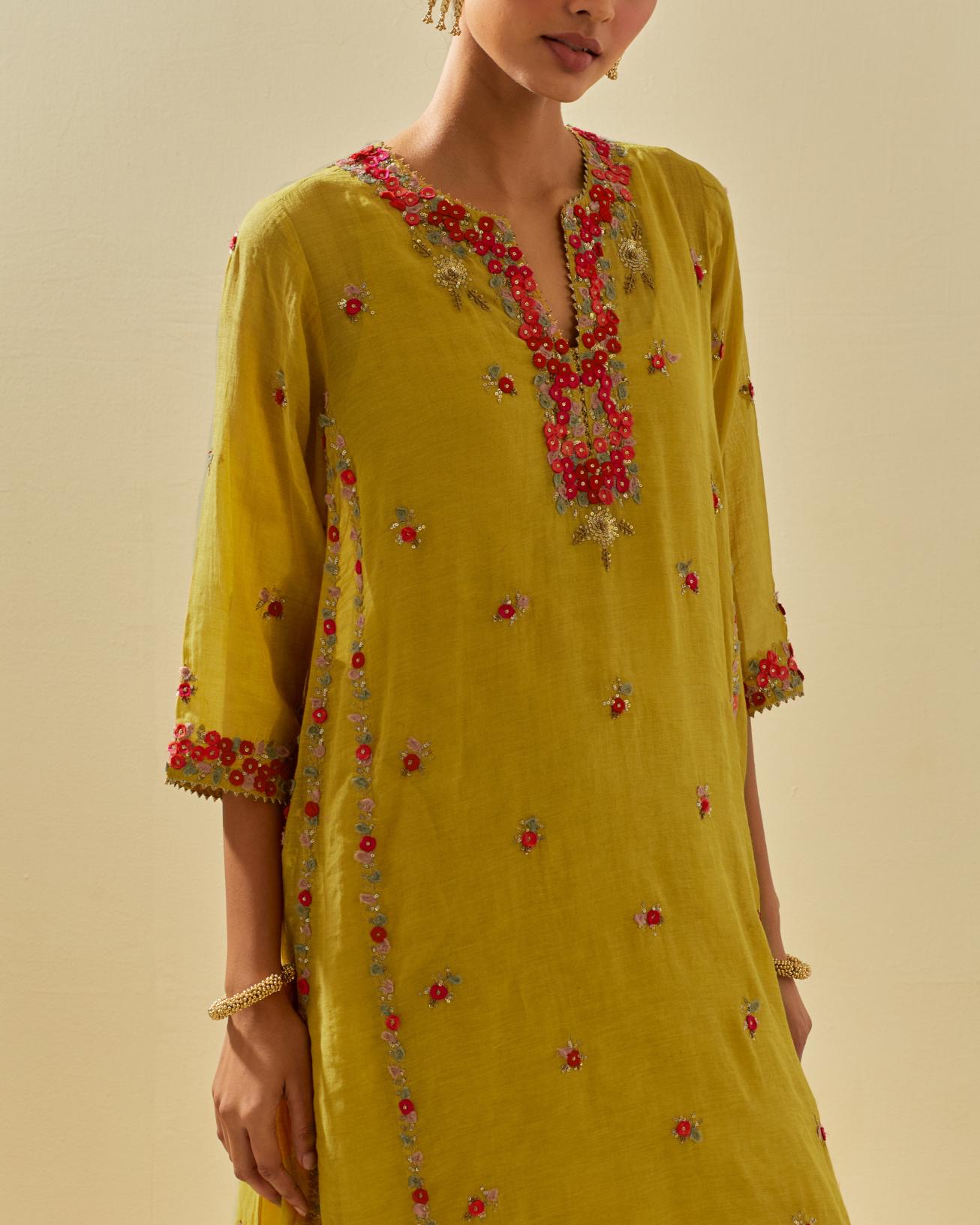 Yellow tissue chanderi mid length kalidar kurta set with hand cut silk flower embroidery, highlighted with gold sequins.
